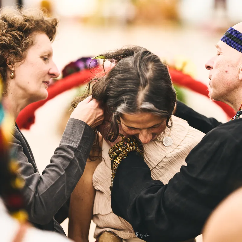 Camille Barrios with her teachers Ya'Acov and Susannah Darling Khan during a summer dance ceremony