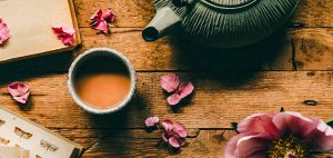 Resources Warm cup of ceremonial cacao with rose petals, prepared for a home ritual